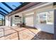 Covered patio with a dining table, ceiling fan, and access to the interior living space at 646 Boundary Blvd, Rotonda West, FL 33947