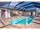 Large pool and patio area with a screened enclosure at 646 Boundary Blvd, Rotonda West, FL 33947