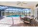 Spacious screened-in pool area overlooking the lake at 646 Boundary Blvd, Rotonda West, FL 33947