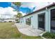 Home with grassy backyard and patio at 691 Linden Dr, Englewood, FL 34223