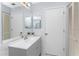 Double sink bathroom with updated vanity and mirror at 691 Linden Dr, Englewood, FL 34223
