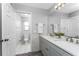 Bathroom with double vanity, modern fixtures, and a separate toilet area at 691 Linden Dr, Englewood, FL 34223