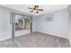 Well-lit bedroom featuring a ceiling fan and window at 691 Linden Dr, Englewood, FL 34223