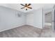 Bright bedroom with ceiling fan, carpet, and large closet at 691 Linden Dr, Englewood, FL 34223