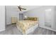 Bedroom featuring carpeted flooring, a ceiling fan, and ample natural light at 691 Linden Dr, Englewood, FL 34223