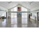 Spacious clubhouse interior with high ceilings and American flag at 691 Linden Dr, Englewood, FL 34223