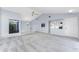 Living room with vaulted ceiling, ceiling fan, and grey carpeting at 691 Linden Dr, Englewood, FL 34223