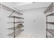 Walk-in pantry with wire shelving, offering ample storage space at 691 Linden Dr, Englewood, FL 34223
