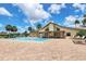 Community pool with plenty of lounge chairs and a covered patio area at 691 Linden Dr, Englewood, FL 34223