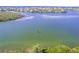 Wide aerial view of waterfront property and waterway at 8017 Bay Pointe Dr, Englewood, FL 34224