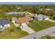 Aerial view of house, pool, and surrounding homes at 9266 Carnation Ave, Englewood, FL 34224