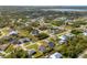 Aerial view of a single-Gathering home with a fenced backyard, situated in a residential neighborhood at 9266 Carnation Ave, Englewood, FL 34224