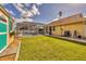 Backyard with shed, pool, and grassy area at 9266 Carnation Ave, Englewood, FL 34224