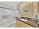 Clean bathroom with granite vanity and a bathtub shower combo at 9266 Carnation Ave, Englewood, FL 34224