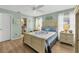 Light and airy bedroom with a queen-size bed and en-suite bathroom at 9266 Carnation Ave, Englewood, FL 34224
