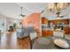Kitchen and dining area with hardwood floors, an open floor plan, and a view of the living room at 9266 Carnation Ave, Englewood, FL 34224