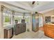 View of kitchen with bay window, granite counters, and ample cabinet space at 9266 Carnation Ave, Englewood, FL 34224