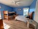 Bedroom with a double bed and a bunk bed, ideal for guests at 9526 Jolly Roger Trl, Placida, FL 33946