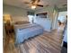 Large bedroom with hardwood floors and a calm atmosphere at 9526 Jolly Roger Trl, Placida, FL 33946