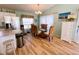 Bright dining area with glass table and wicker chairs at 9526 Jolly Roger Trl, Placida, FL 33946