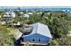 Charming coastal home featuring a rooftop deck with ocean views in a lush, tropical setting at 9526 Jolly Roger Trl, Placida, FL 33946