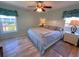 Spacious main bedroom with hardwood floors and large windows at 9526 Jolly Roger Trl, Placida, FL 33946
