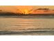 Scenic view of the sunset over calm waters, creating a tranquil atmosphere at 9526 Jolly Roger Trl, Placida, FL 33946