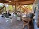 Spacious covered porch with seating, a grill, and outdoor space at 9526 Jolly Roger Trl, Placida, FL 33946