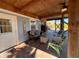 Relax on this covered porch with seating and outdoor space at 9526 Jolly Roger Trl, Placida, FL 33946