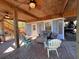 Enjoy the covered porch, complete with seating and ceiling fans at 9526 Jolly Roger Trl, Placida, FL 33946
