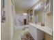 Clean bathroom includes a shower/tub combo, vanity with storage, and tiled flooring at 524 Pine Hollow Cir # 524, Englewood, FL 34223