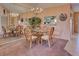 Casual dining area with a glass top table and wicker chairs at 524 Pine Hollow Cir # 524, Englewood, FL 34223