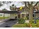 Front view of condo building with parking and landscaping at 524 Pine Hollow Cir # 524, Englewood, FL 34223