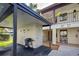 Condo building exterior with covered parking and grill at 524 Pine Hollow Cir # 524, Englewood, FL 34223