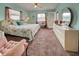 Spacious main bedroom with a king-size bed and plenty of light at 524 Pine Hollow Cir # 524, Englewood, FL 34223