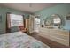 Main bedroom with king bed and access to a private balcony at 524 Pine Hollow Cir # 524, Englewood, FL 34223