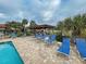 Community pool area with pergola and lounge chairs at 524 Pine Hollow Cir # 524, Englewood, FL 34223