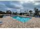 Community pool with plenty of lounge chairs at 524 Pine Hollow Cir # 524, Englewood, FL 34223