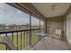 Peaceful screened balcony overlooking the lake and community at 524 Pine Hollow Cir # 524, Englewood, FL 34223