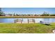 Private dock with kayak on a calm canal, offering serene waterfront living at 119 Bunker Rd, Rotonda West, FL 33947