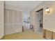 A hallway with built-in cabinets and access to other rooms at 1460 Duncan Pl, Englewood, FL 34223