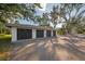 Three-car garage with dark brown doors and ample parking at 149 Englewood Isles Pkwy # 606, Englewood, FL 34223