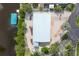 Aerial view showcasing home's layout, dock and the surrounding waterfront at 1493 Janet Pl, Englewood, FL 34223