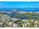 Panoramic aerial view of the coastal community, showcasing waterfront properties and waterways at 1493 Janet Pl, Englewood, FL 34223