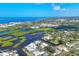 Expansive aerial view of the coastal community with waterfront homes and lush mangroves at 1493 Janet Pl, Englewood, FL 34223