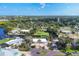 An aerial view of the home, showing the surrounding neighborhood and lush greenery at 1493 Janet Pl, Englewood, FL 34223