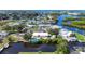 An aerial view of the home showing its location on a waterfront canal at 1493 Janet Pl, Englewood, FL 34223