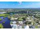 An aerial view of a waterfront community, with canals, streets, and lush landscaping at 1493 Janet Pl, Englewood, FL 34223