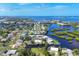 An aerial view of the waterfront community, showcasing the abundance of canals and homes at 1493 Janet Pl, Englewood, FL 34223