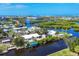 Aerial view showcases waterfront community, canals, and stunning coastal location at 1493 Janet Pl, Englewood, FL 34223